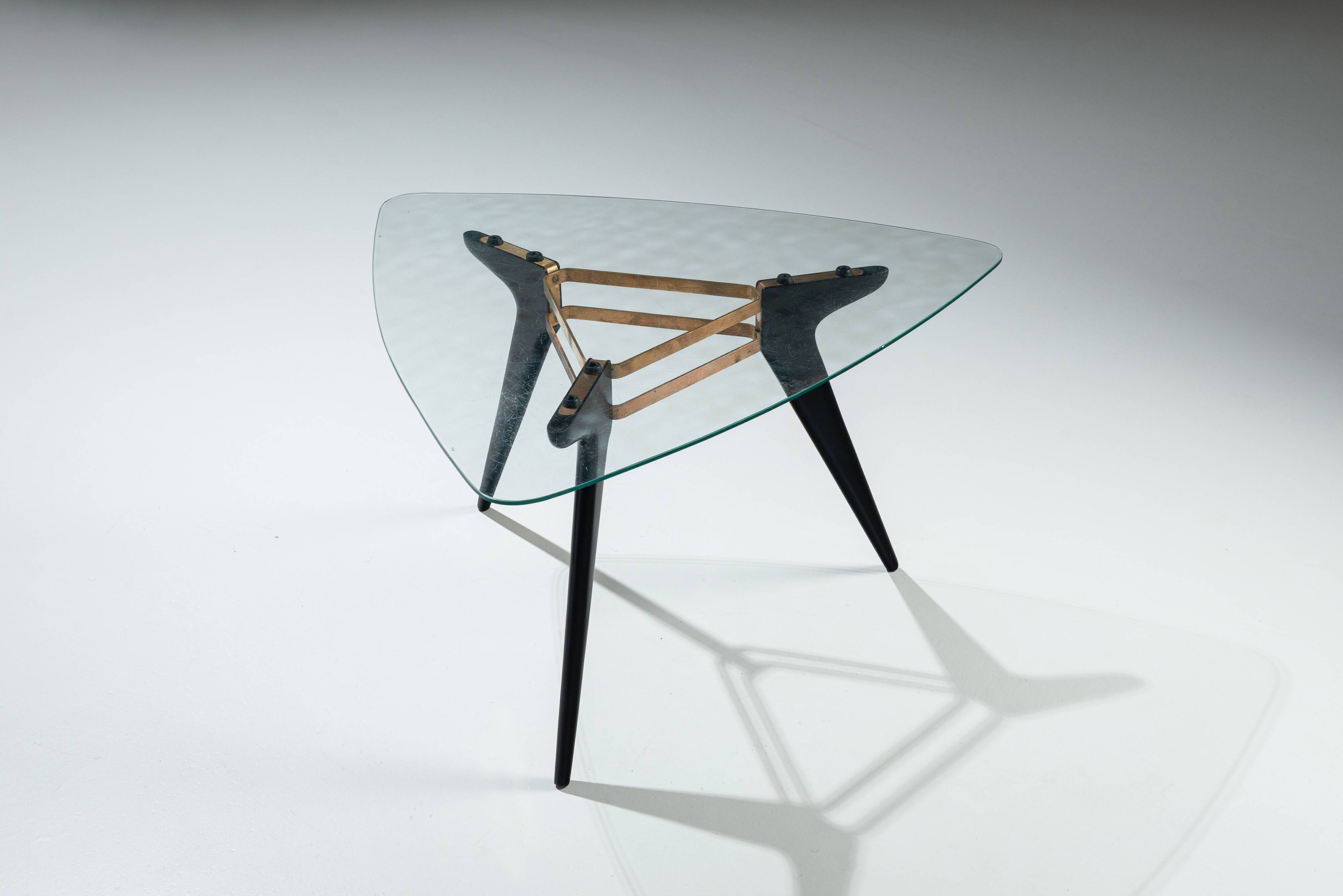 Triangular coffee table in the manner of Alfred Hendrickx