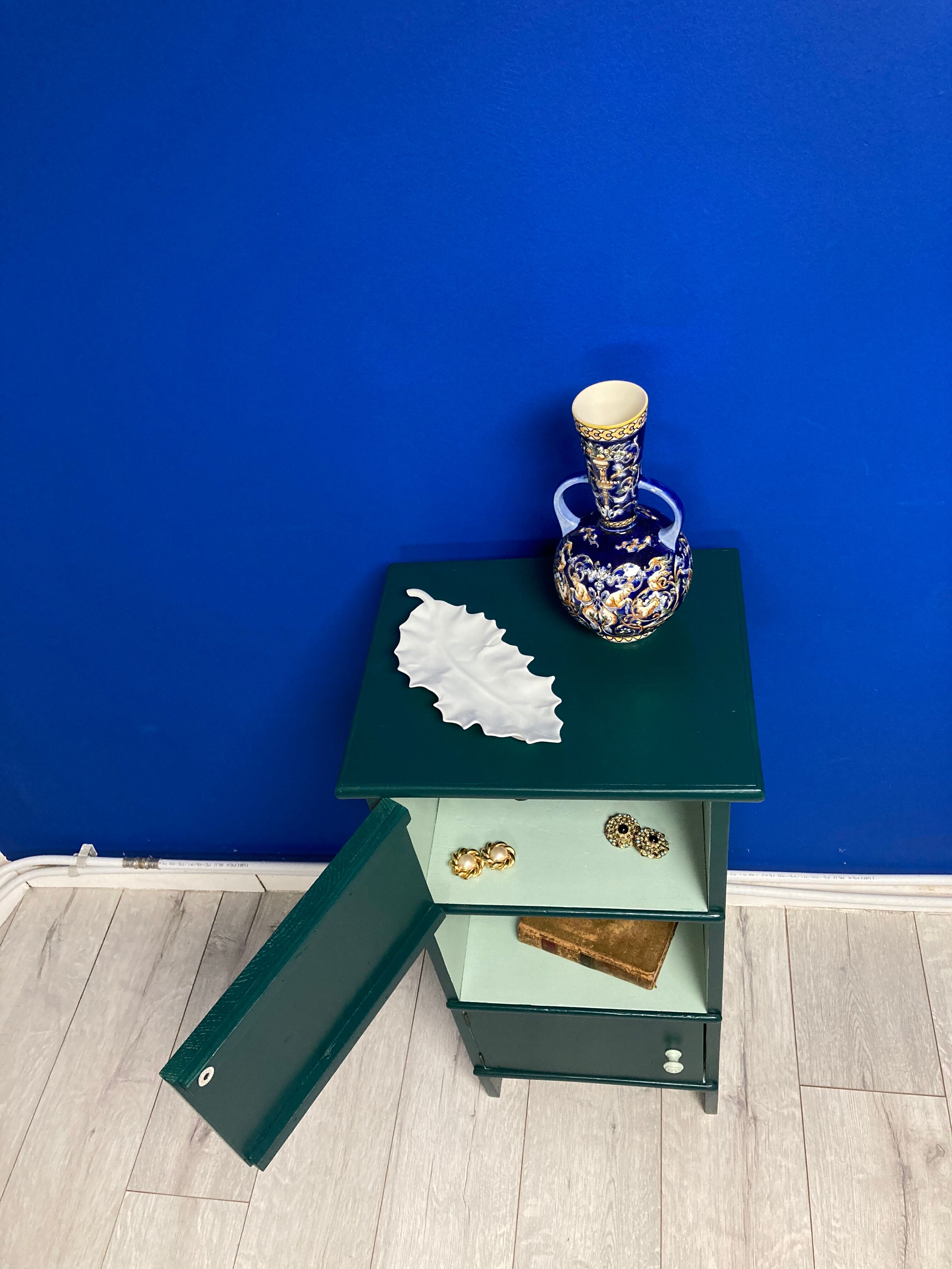Two-door green bedside table