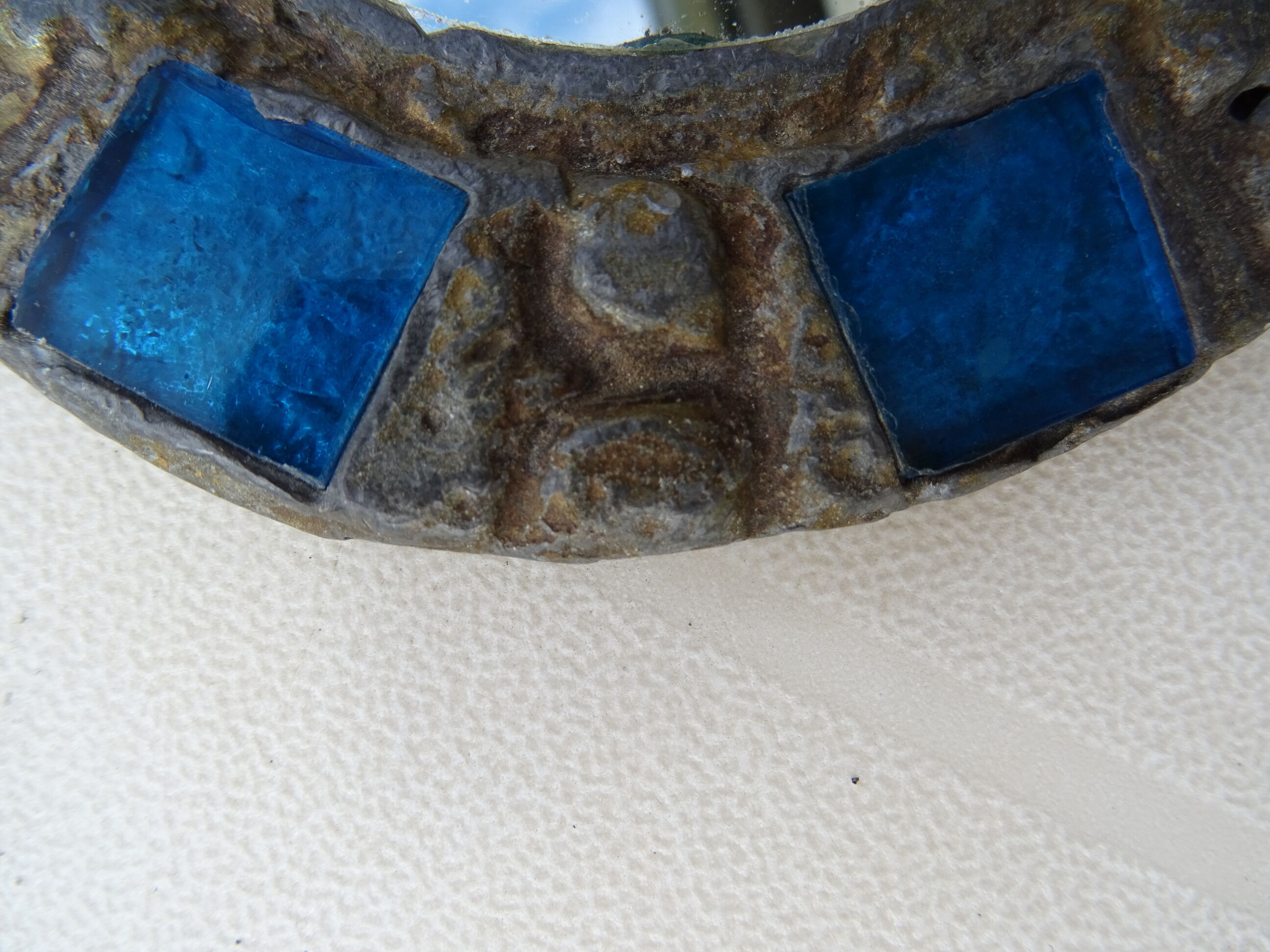 Mirror in metal and blue glass