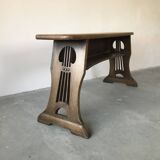 Art and Crafts style organ bench in solid oak.