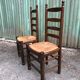 Duo of vintage rustic straw straw chairs in oak.