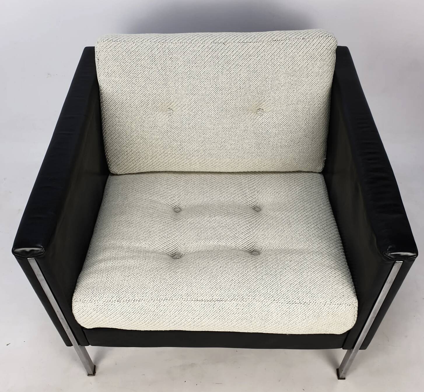 Pair of armchairs by Pierre Paulin for Artifort, black leather and cream fabric.