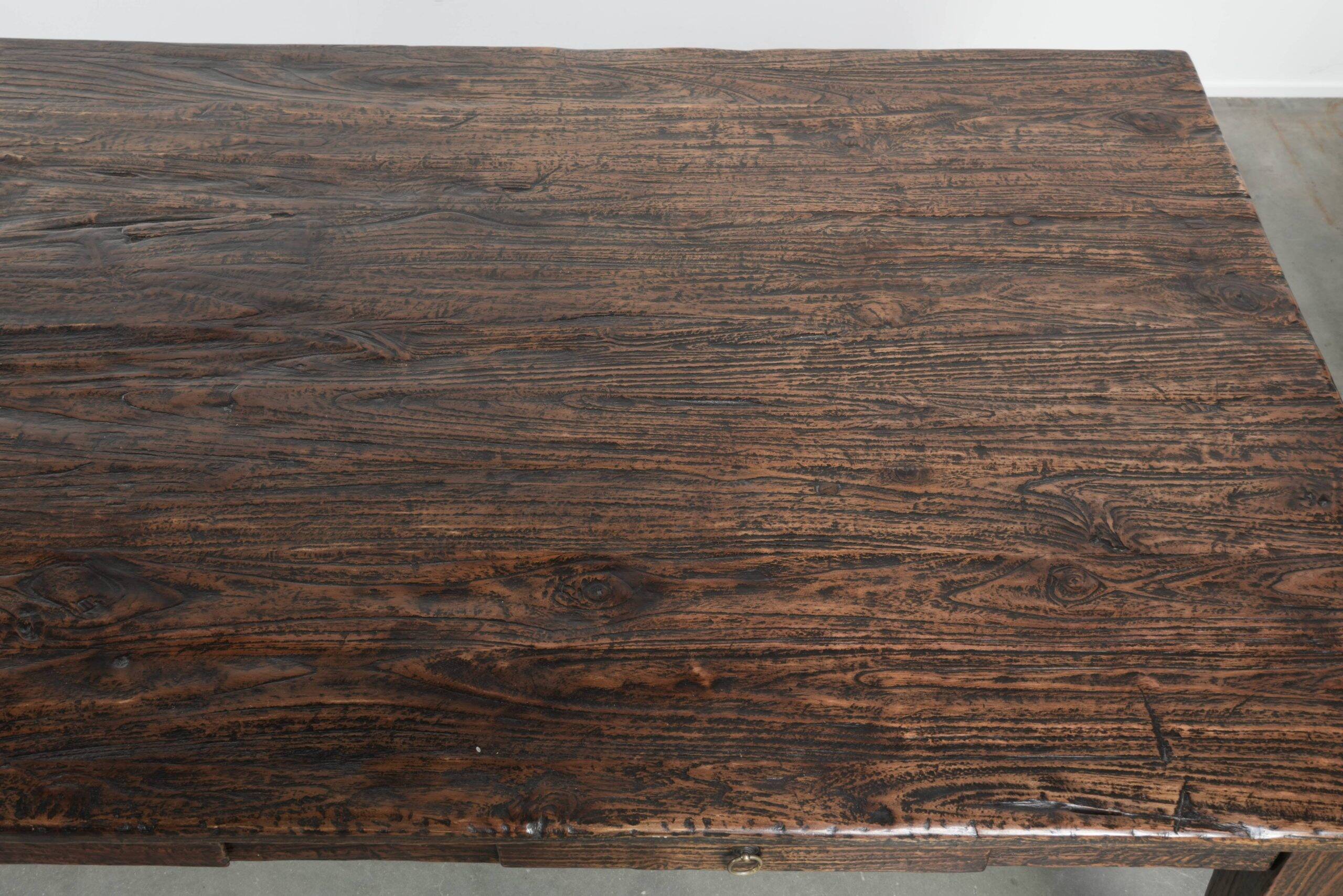 Large rustic dining table made of atmospheric elm wood with fine details