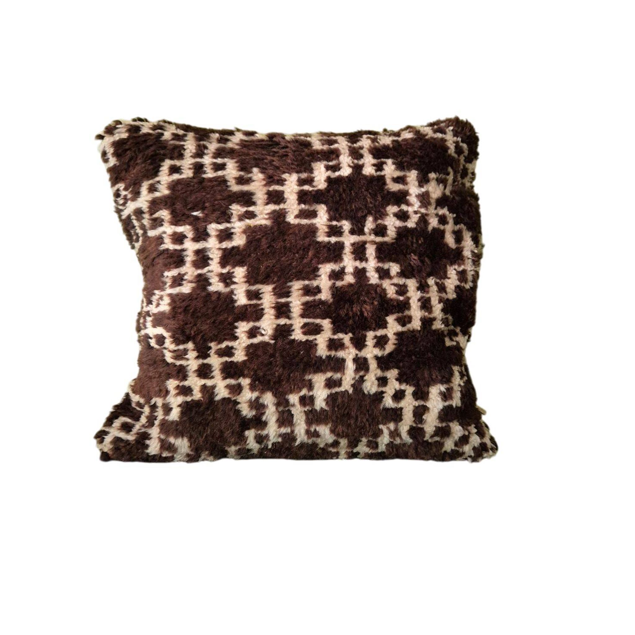 Cushion cover in an ancient Berber rug.