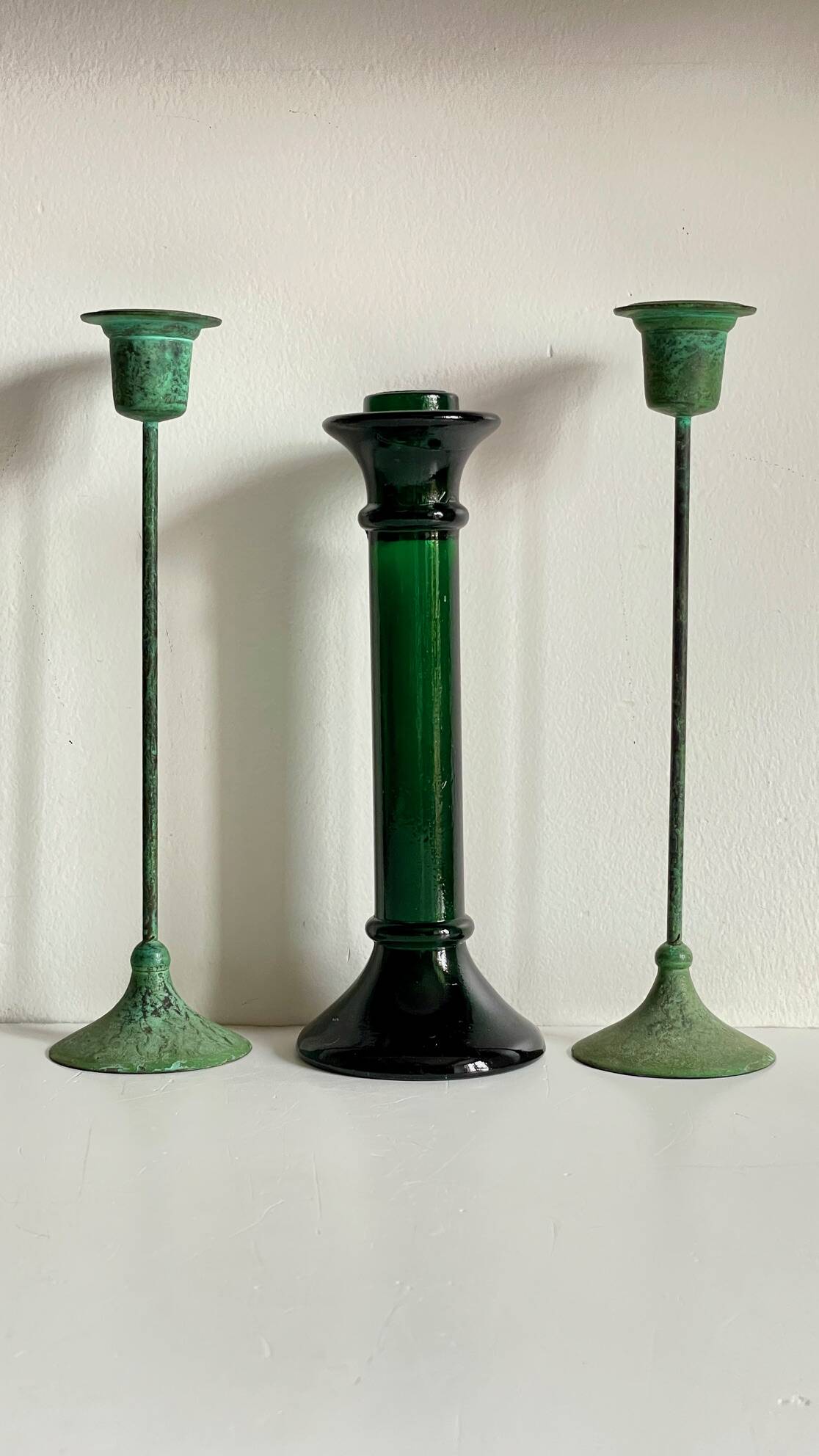 Green glass and metal candle holders