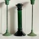 Green glass and metal candle holders