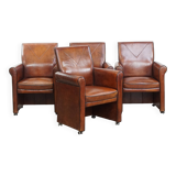 Vintage set of 4 sheepskin leather dining chairs on castors