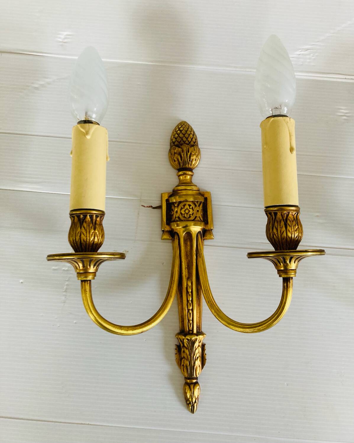 St Louis XVI gilded bronze wall lights with foliage and pine cone decorations