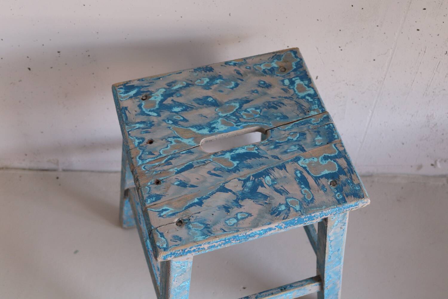 Blue patinated farm stool