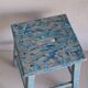 Blue patinated farm stool