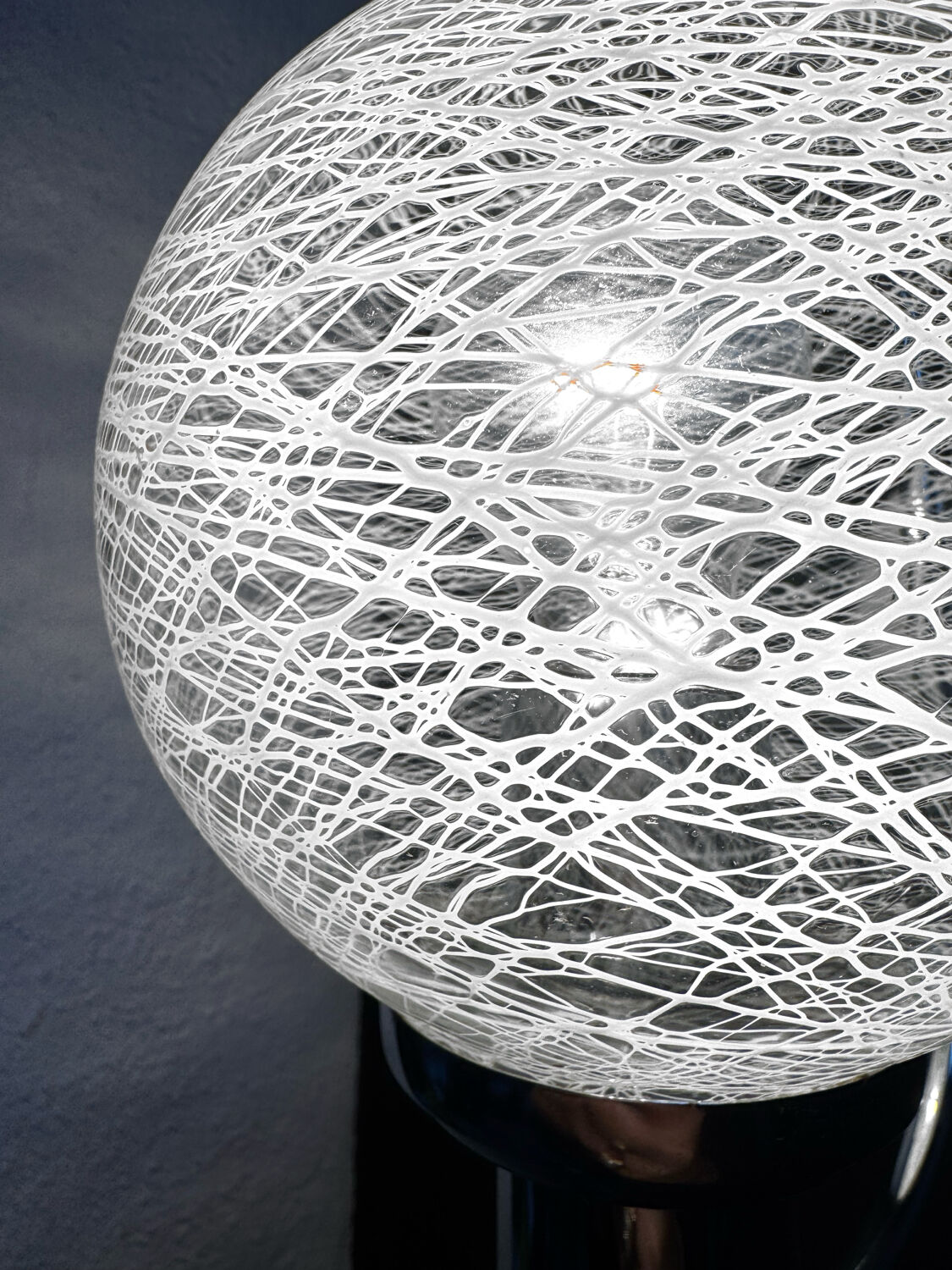 Chrome wall light with blown glass from the 1970s.