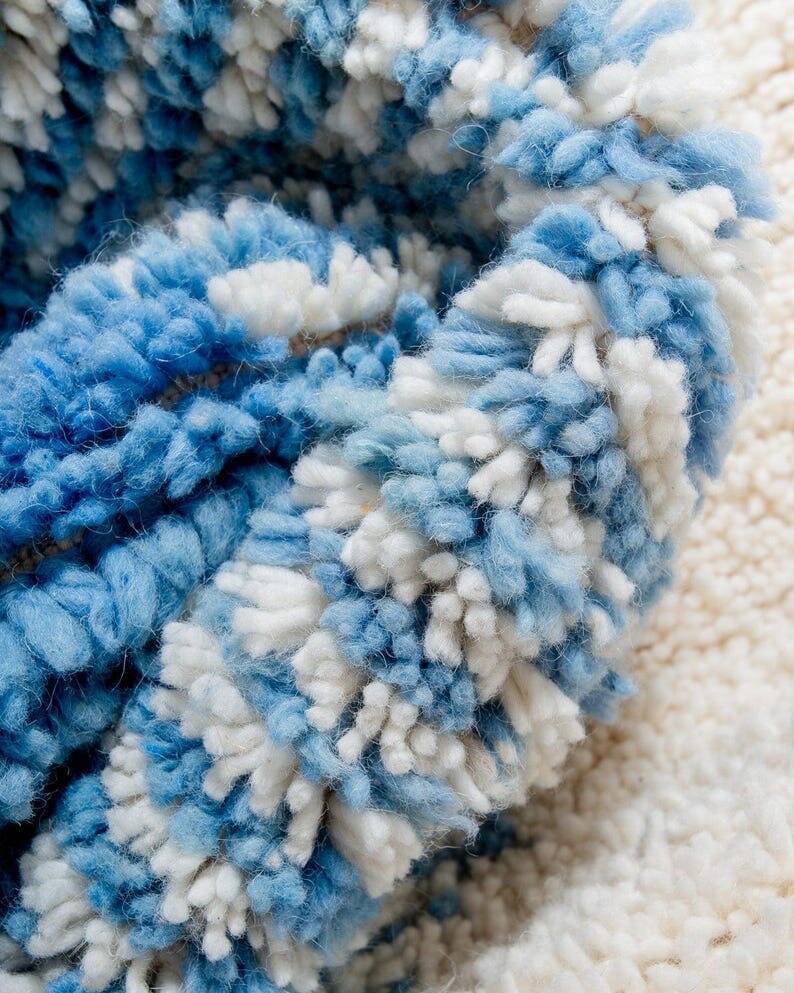 Wool rug with colourful patterns, size 150/250 cm.
