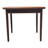 Petite table de salle à manger extensible en teck d'époque.
