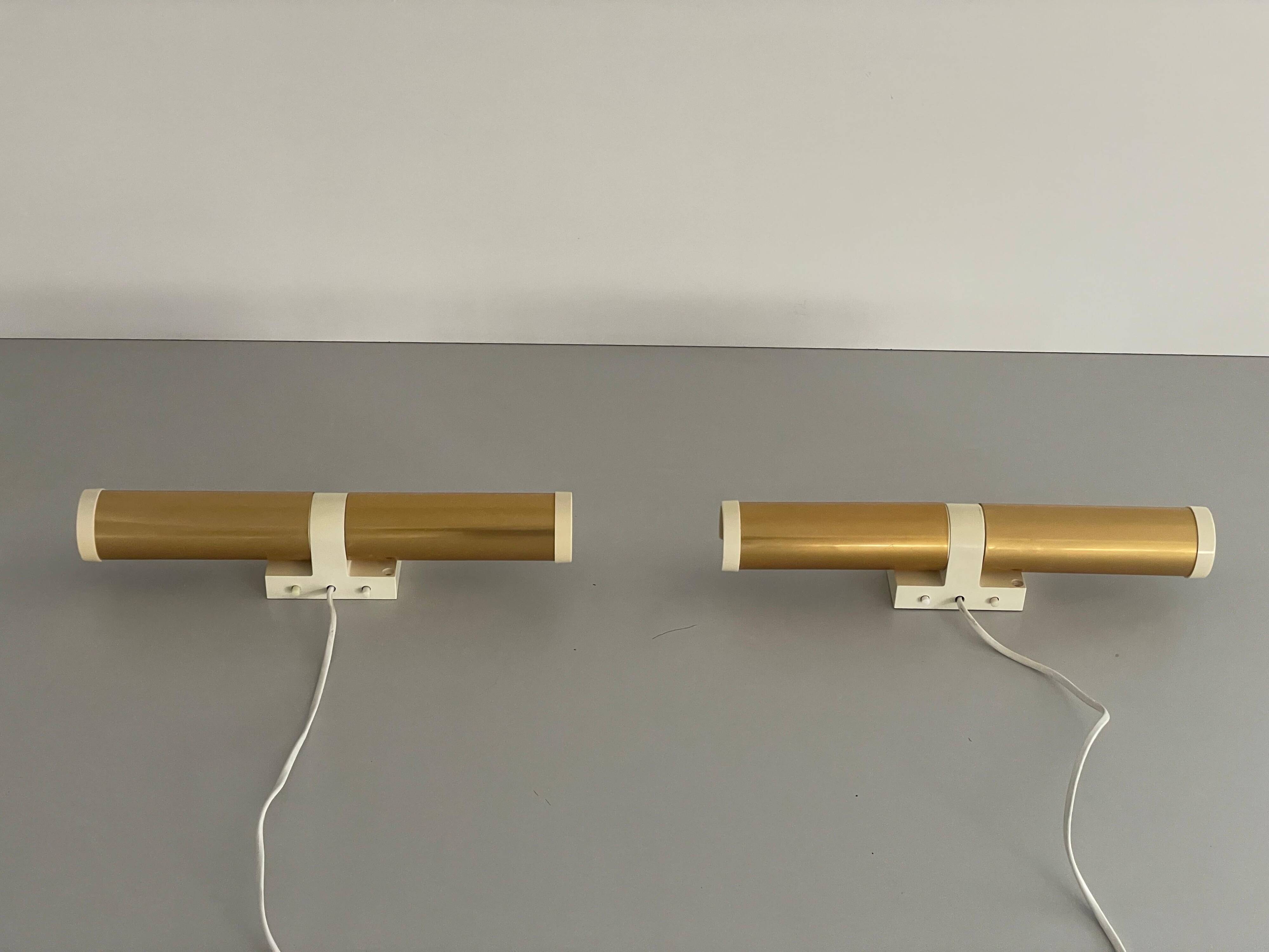Pair of two-headed wall sconces in gold metal by ERCO, 1970s, Germany