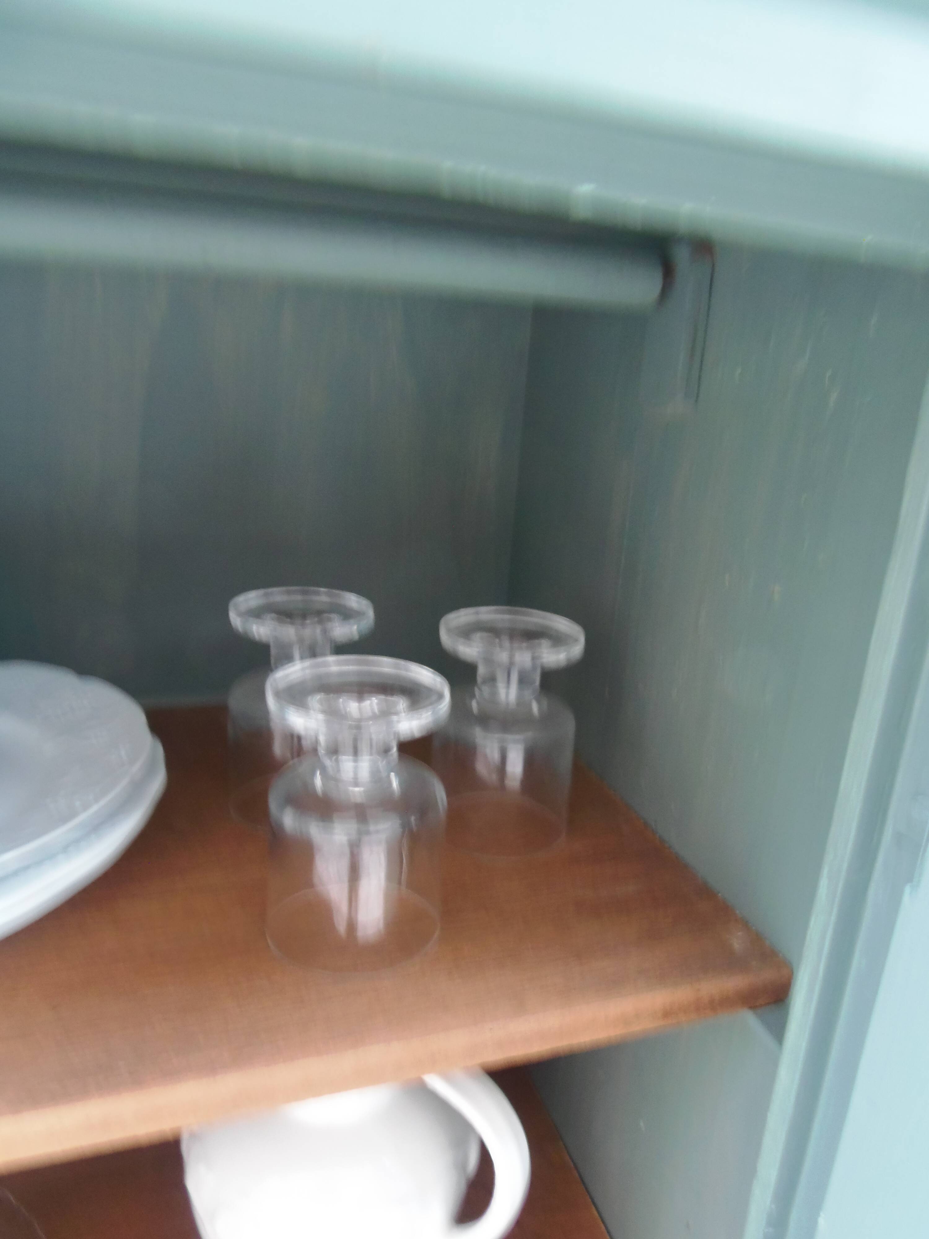 Vintage jam jar enhanced in smoky green, wooden tray.