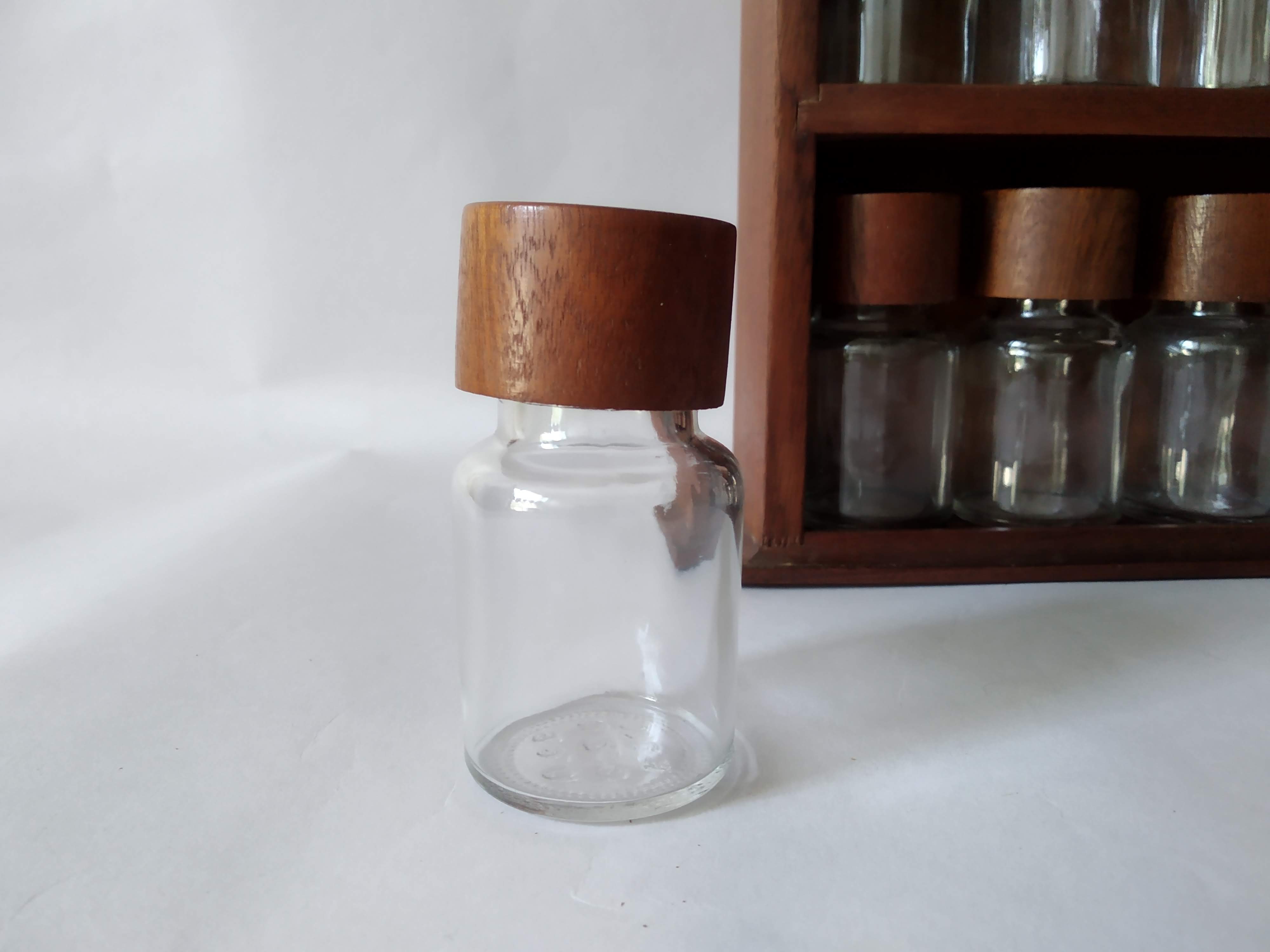 Wooden shelf with 32 vintage Cole & Mason spice jars