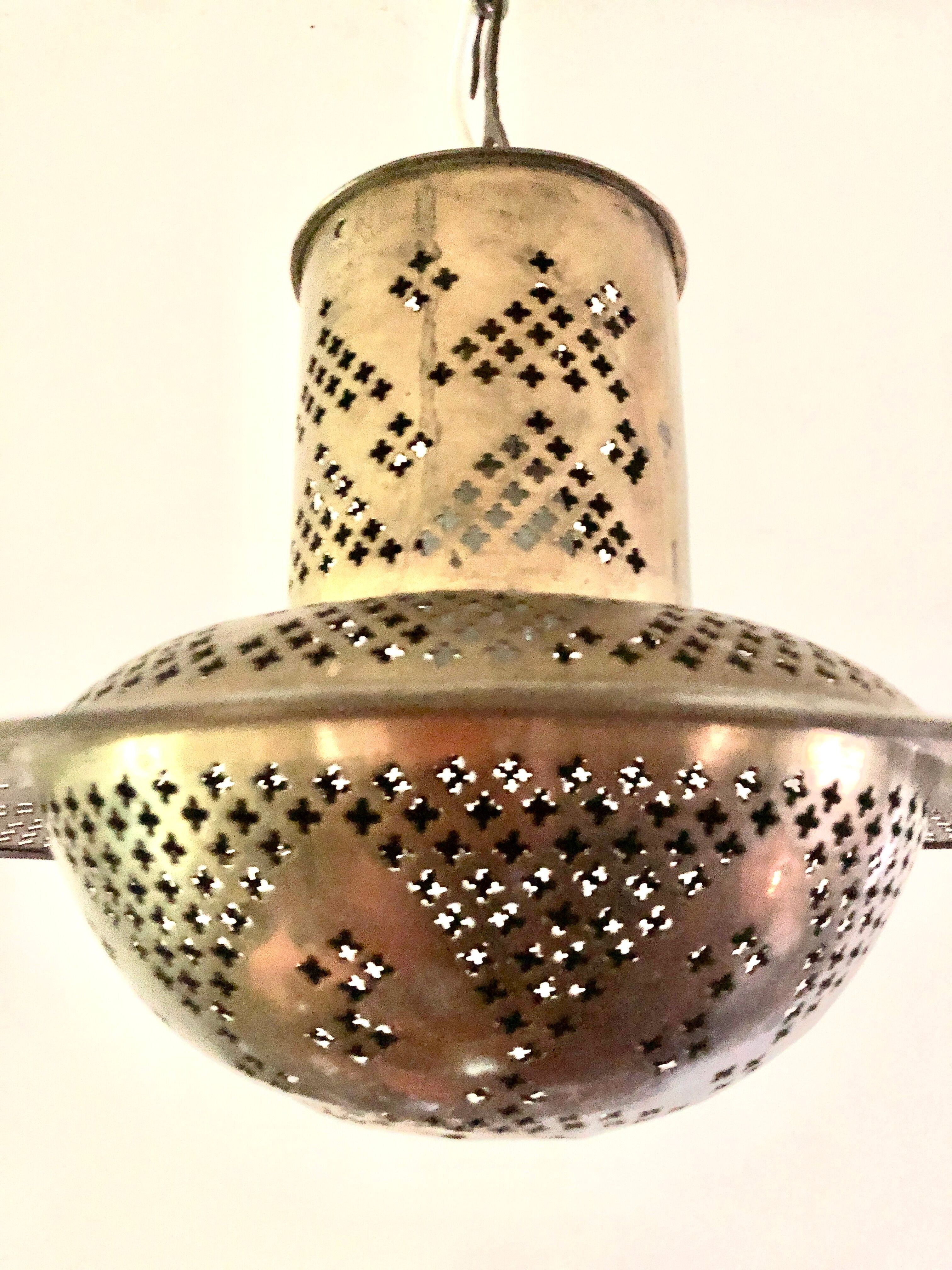 Perforated gilded metal lantern