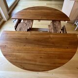 Extendable round table in solid walnut, 125cm in diameter, 5 extensions.