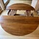 Extendable round table in solid walnut, 125cm in diameter, 5 extensions.