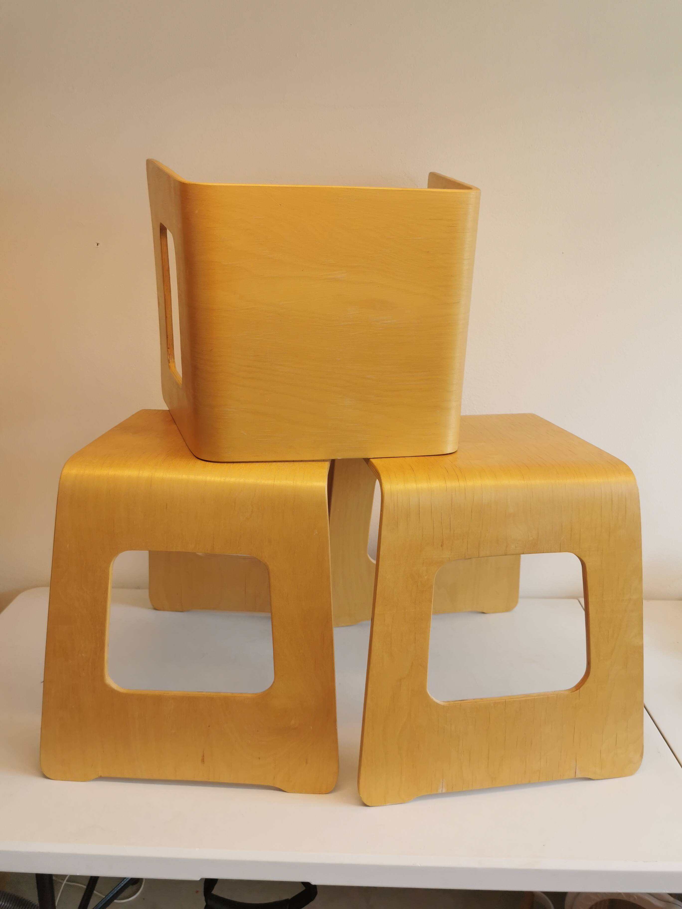 Design stool/side table made of curved plywood.