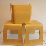 Design stool/side table made of curved plywood.