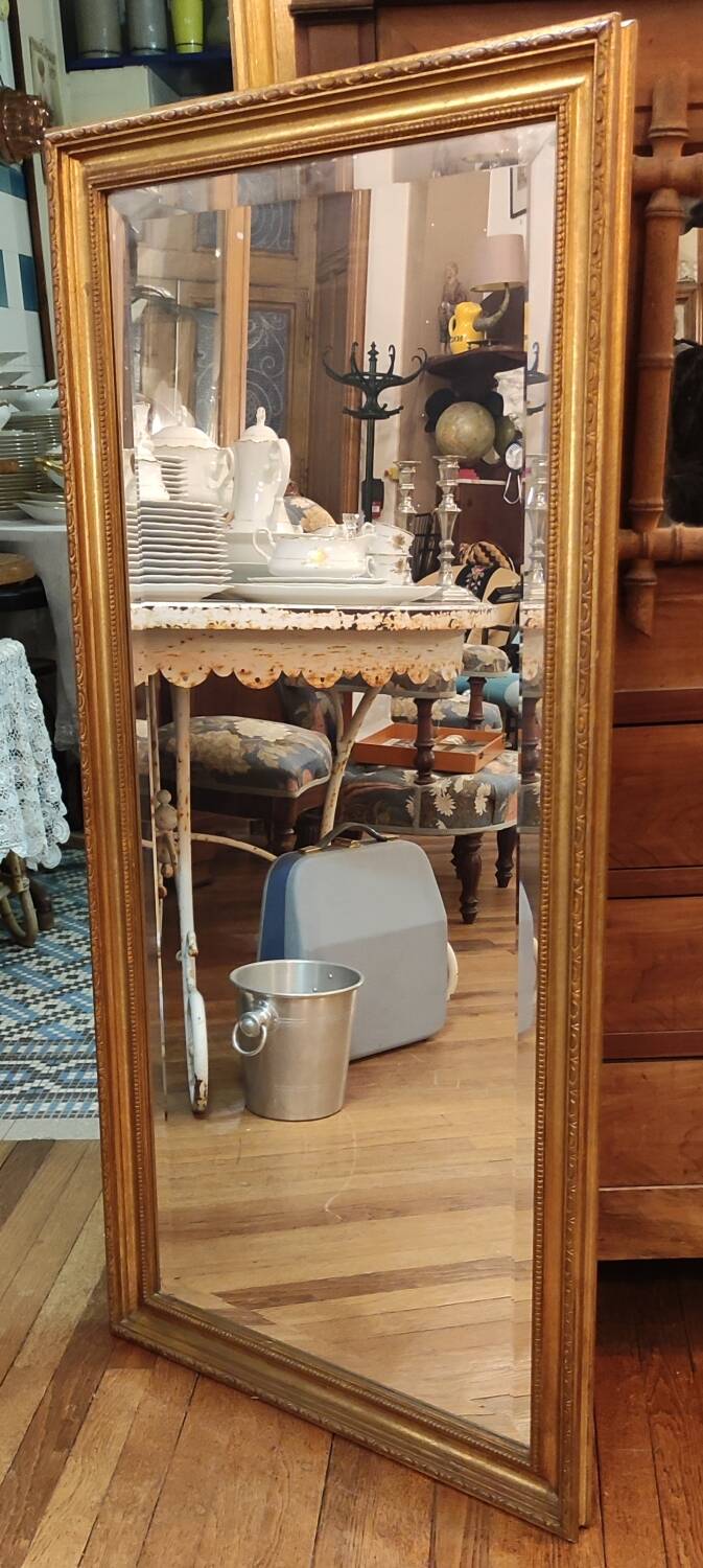 Old beveled mirror with gilded wood frame 20th century