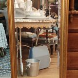 Old beveled mirror with gilded wood frame 20th century