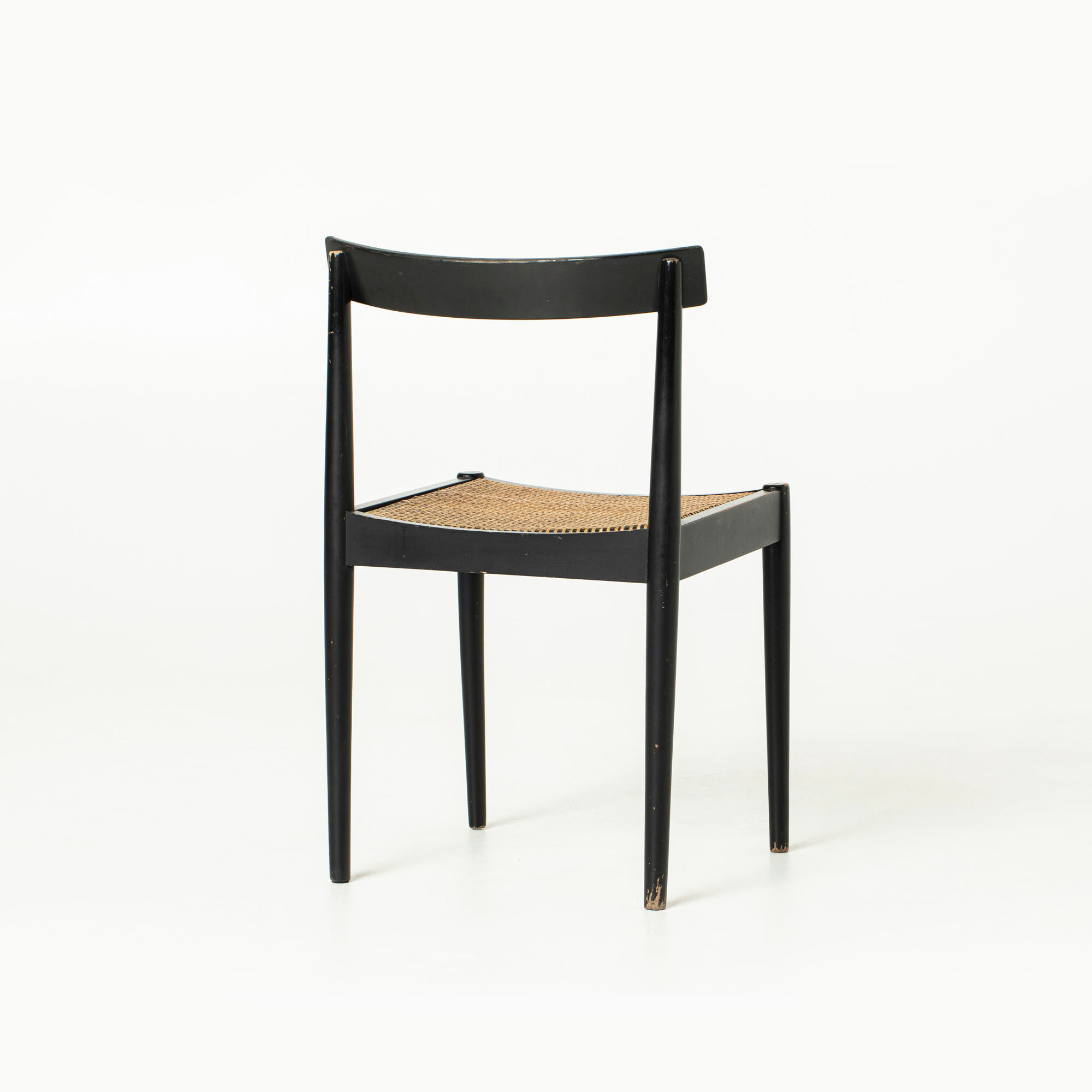Mid-century dining chair in black laquered wood and cane