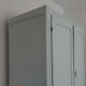 Art Deco wardrobe with shelves and drawers, renovated wood.