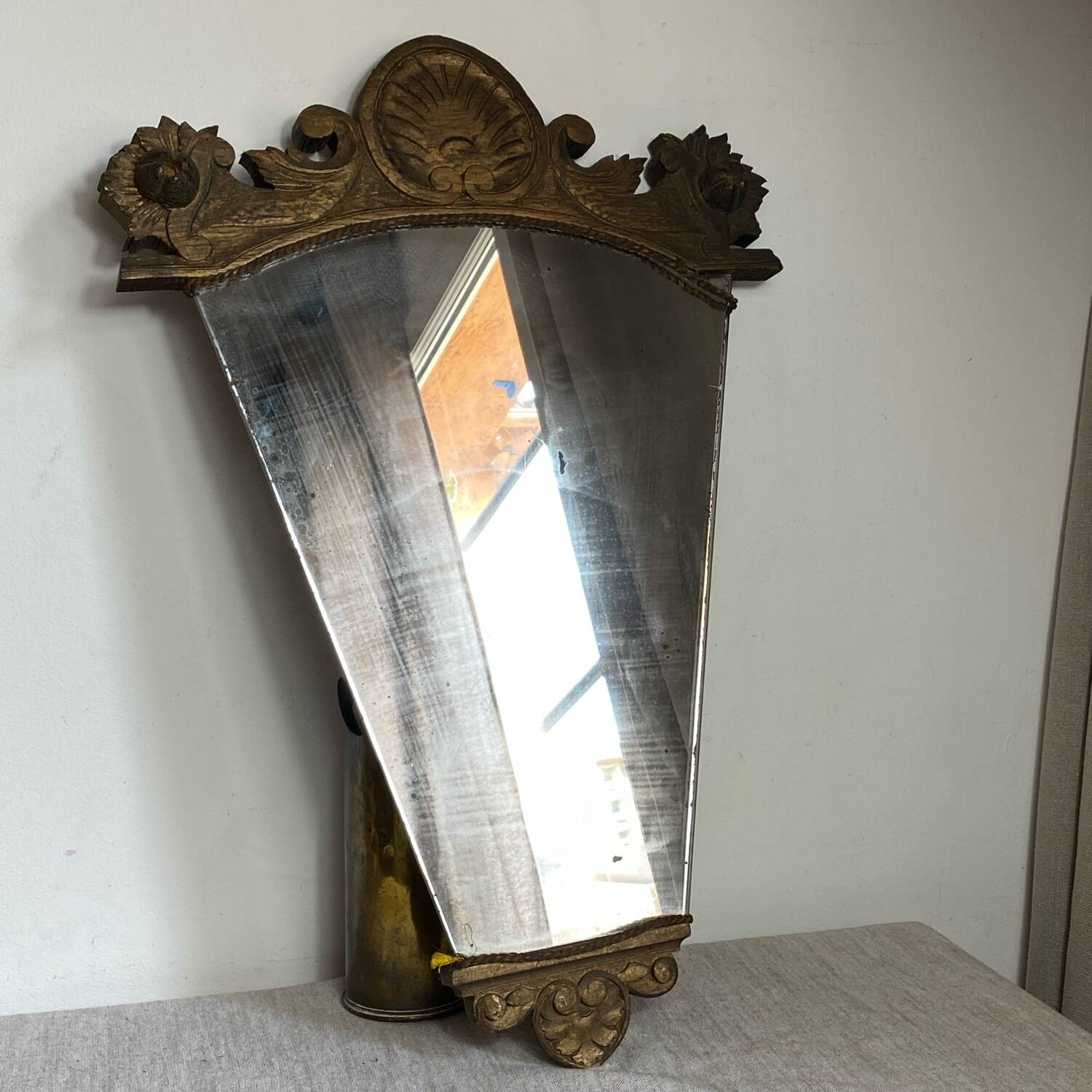 Antique wooden mirror with an unusual shape