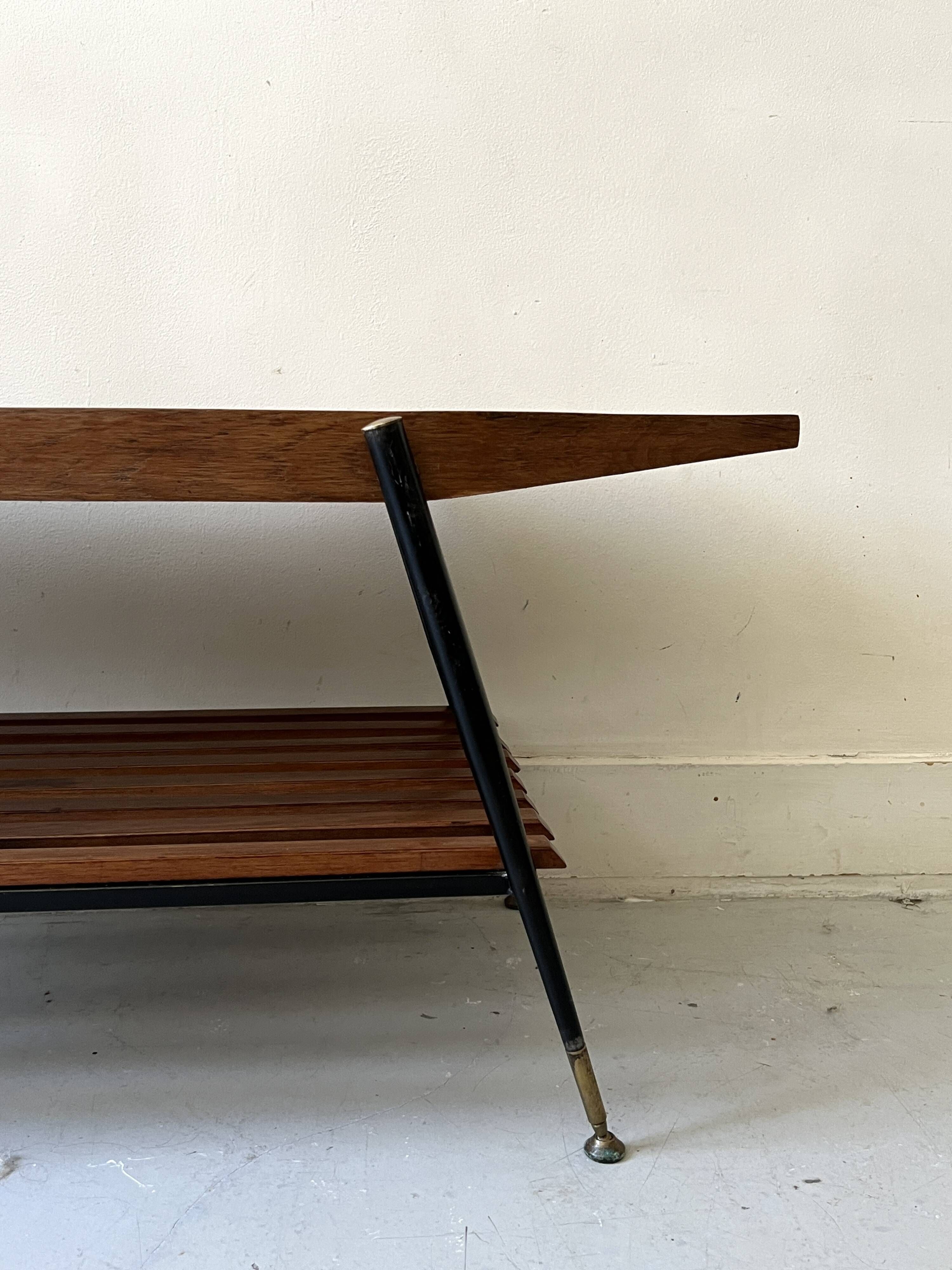 Mid-century coffee table with 2 mahogany wood tops and brass detail, Italy.