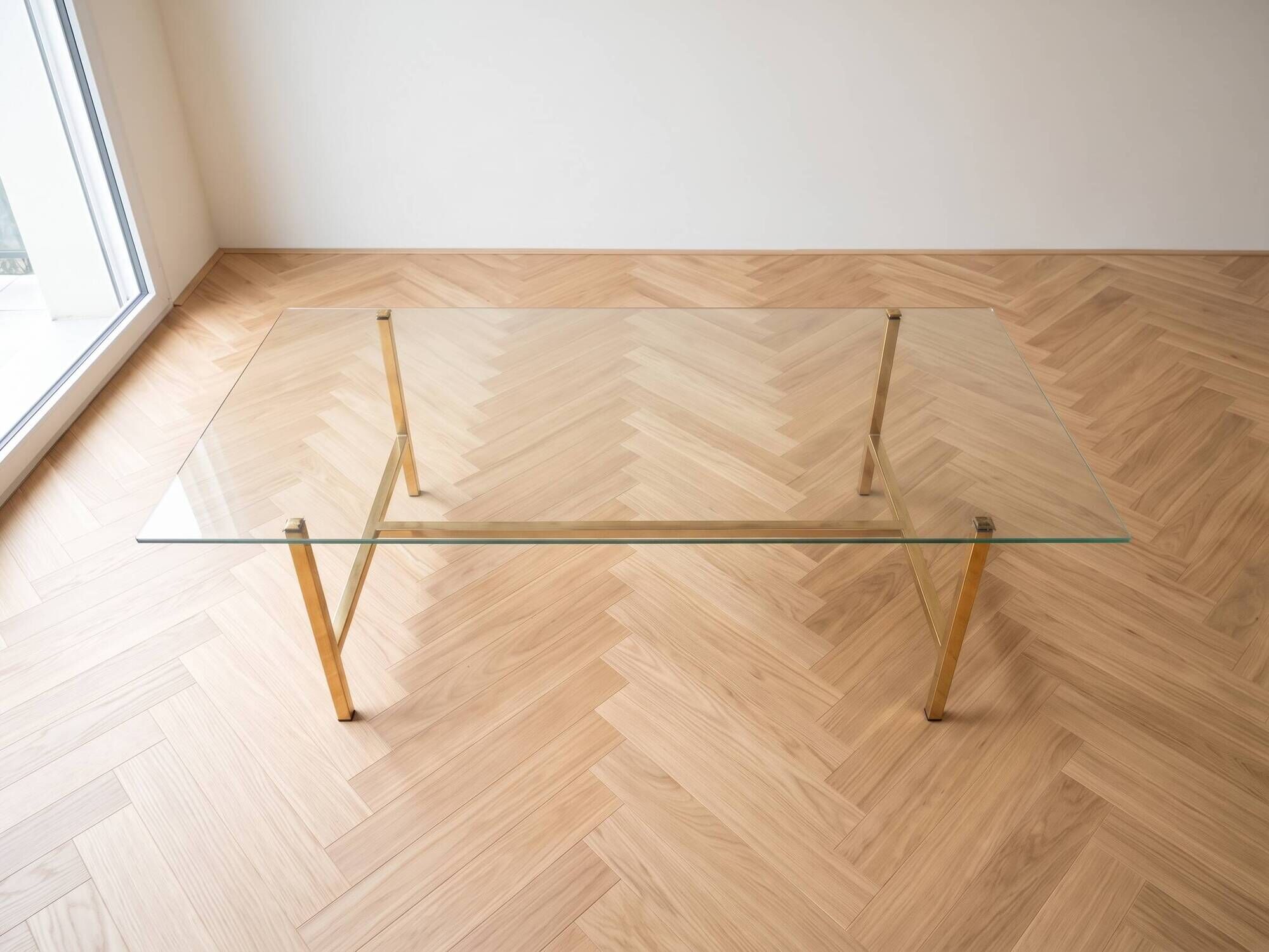 Vintage coffee table with glass and gold metal.
