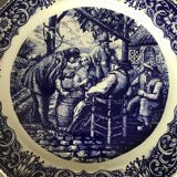 Blue enamelled earthenware wall dish with peasant scene decor Boch La Louvière