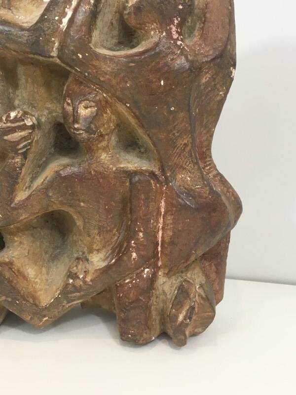 Plaster sculpture depicting a group of 3 figures