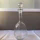 Carved glass decanter with floral decorations
