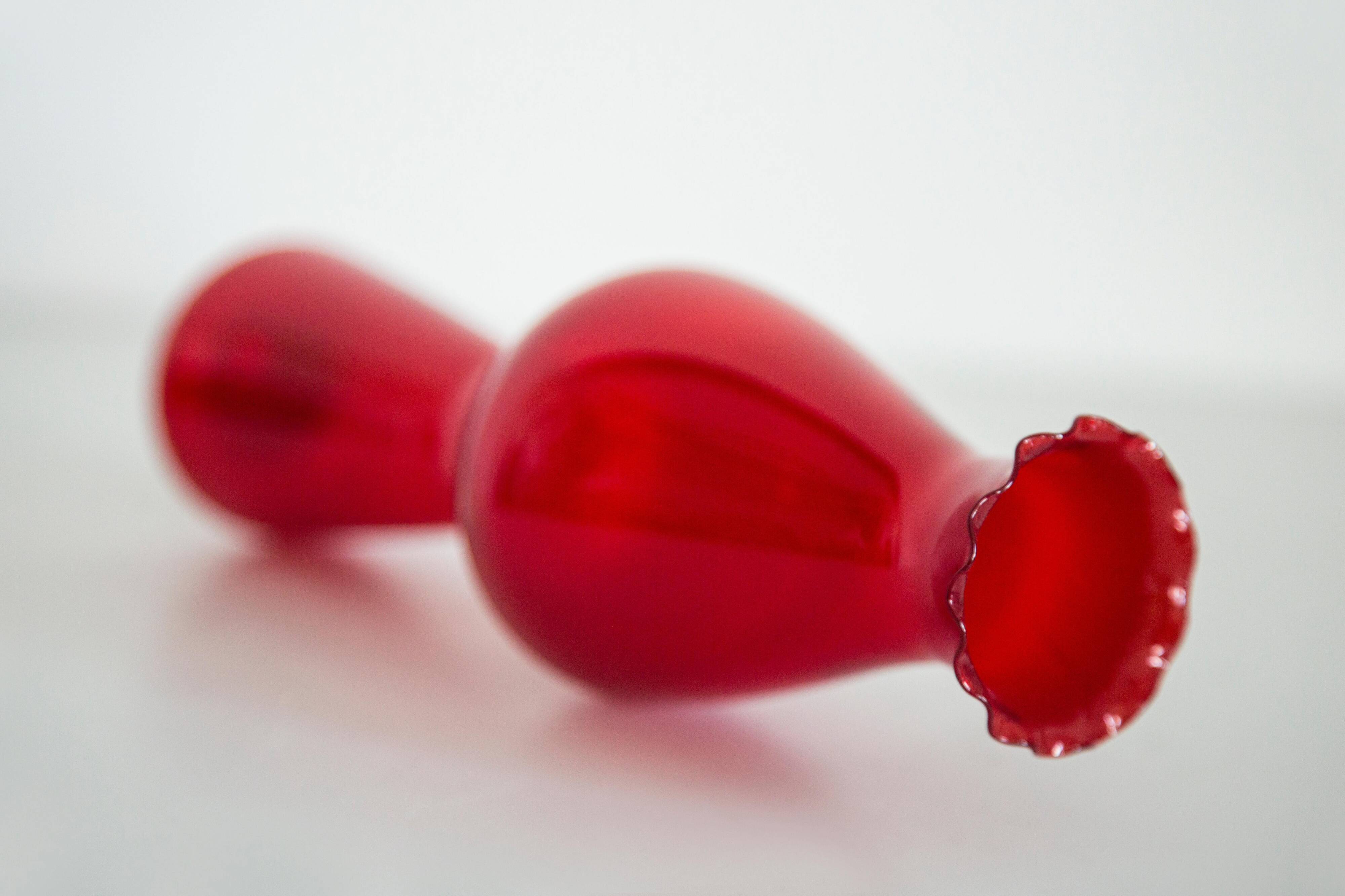 Thin red glass vase from the mid-century with a ruffle, Europe, 1960s