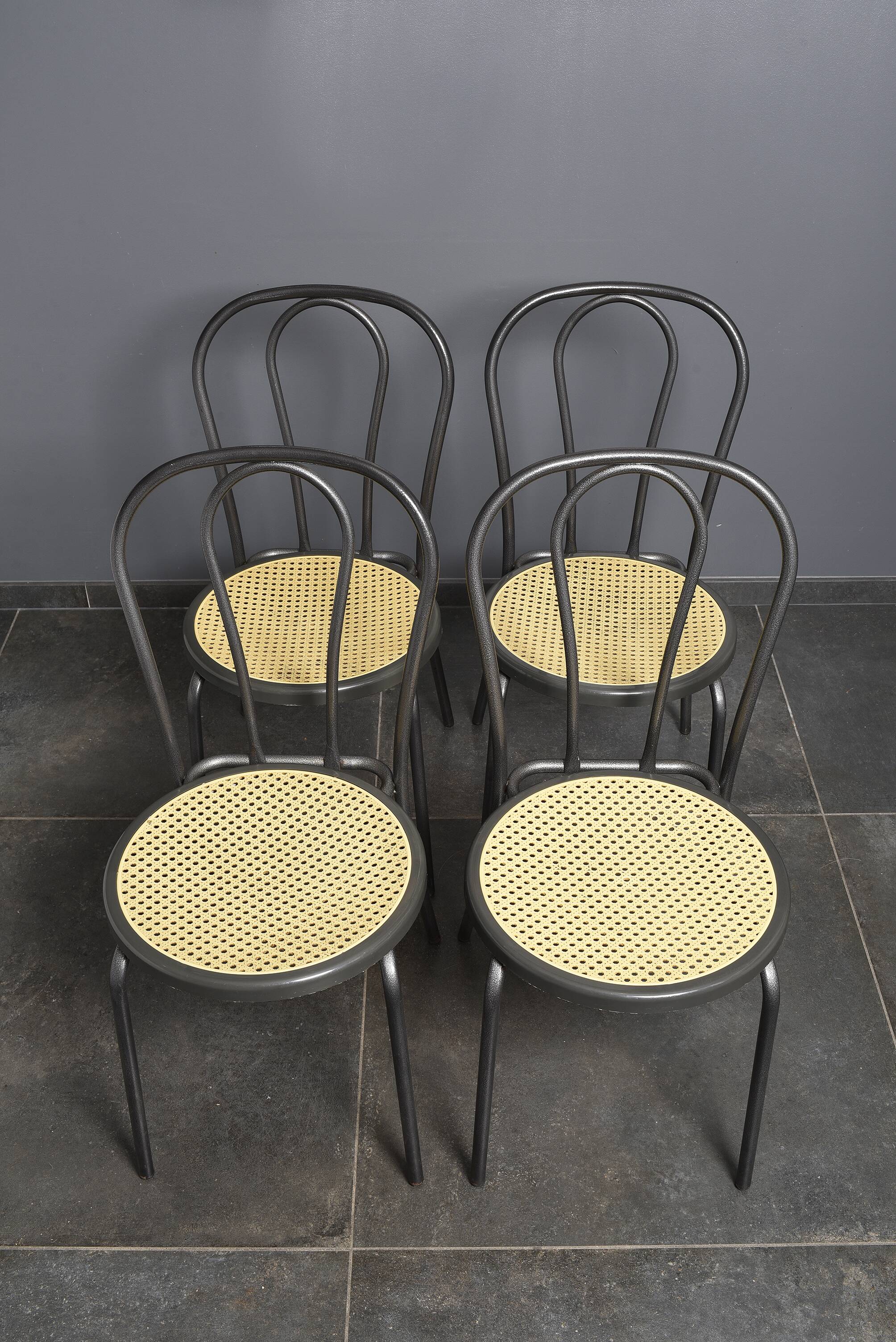 Bistro chairs, imitation cane seat.