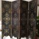 Four-panel Japanese-style screen in red and gold lacquer.