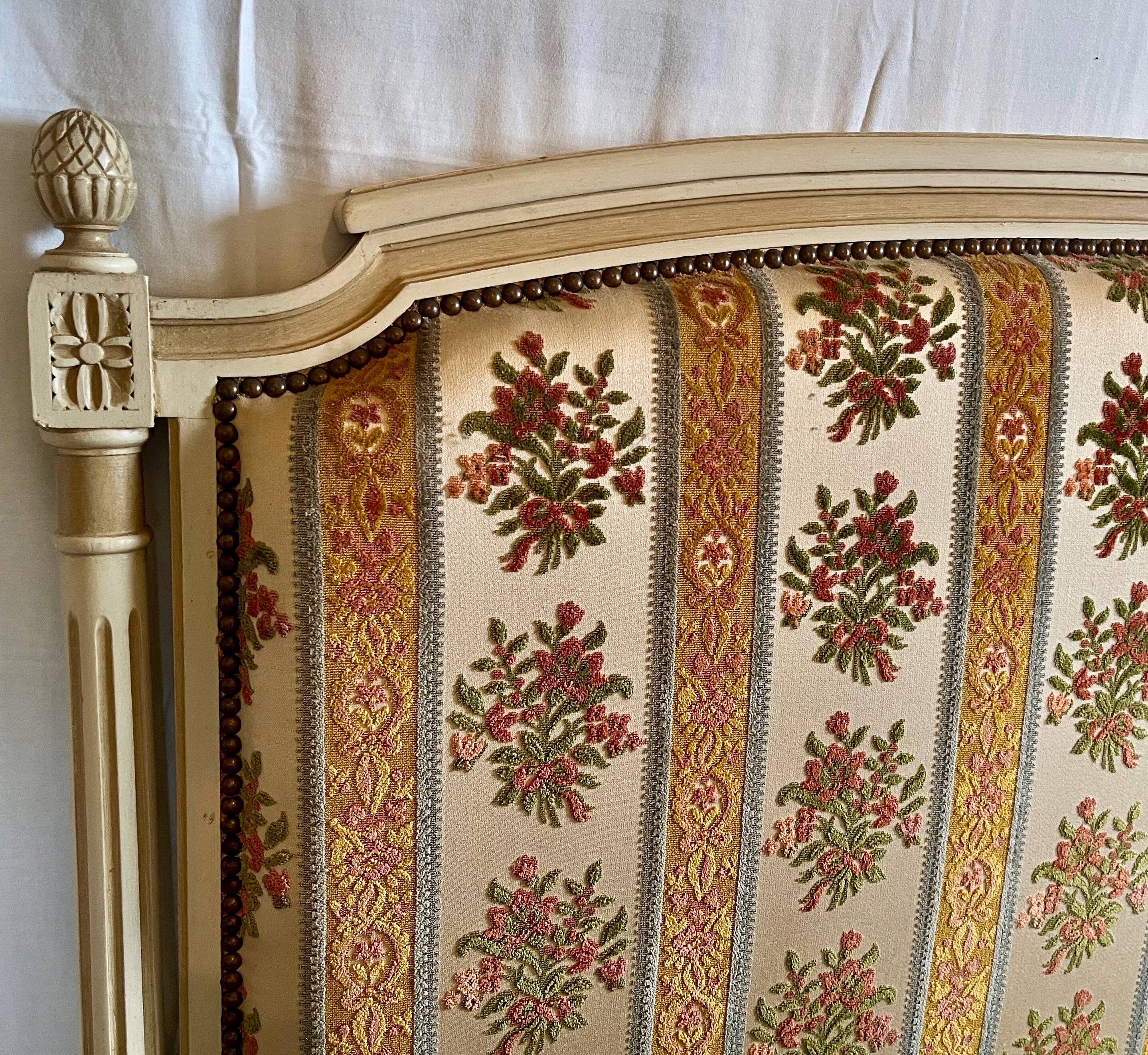 Louis XVI style bed in patinated wood with fluted columns.