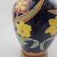 Large multicoloured ceramic vase with floral decoration signed NT.