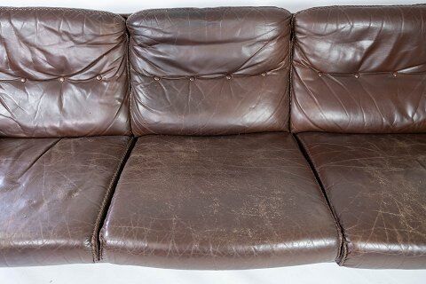 Three seater sofa upholstered with patinated brown leather by Arne Norell, 1970s