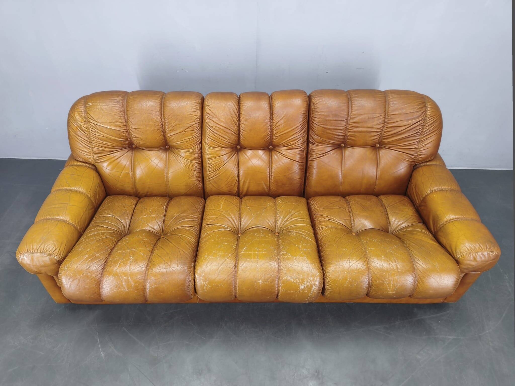 Three-seater sofa from the mid-century produced in Italy in the 1970s.