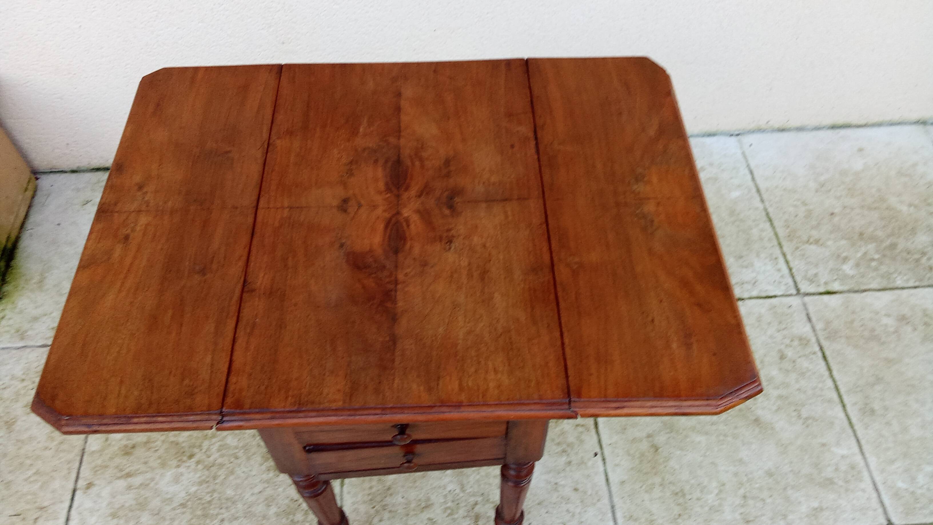 Antique small drop-leaf table from the 19th century.