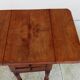 Antique small drop-leaf table from the 19th century.