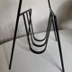 Modernist magazine rack French work 1950 in iron and brass