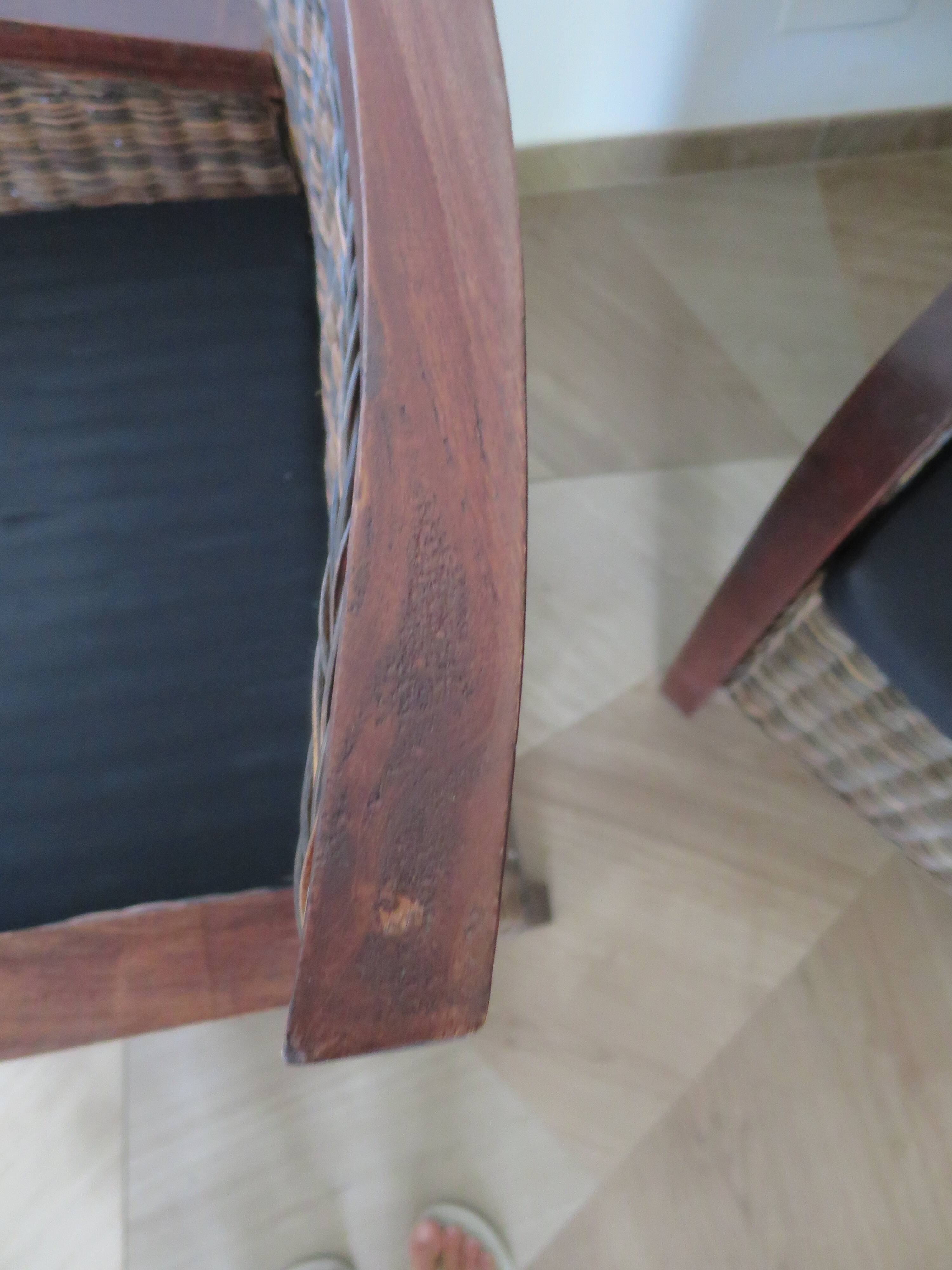 2 colonial-style armchairs in woven rattan and exotic wood