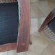 2 colonial-style armchairs in woven rattan and exotic wood