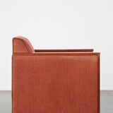 Art Deco design armchair with red fabric upholstery and wooden details