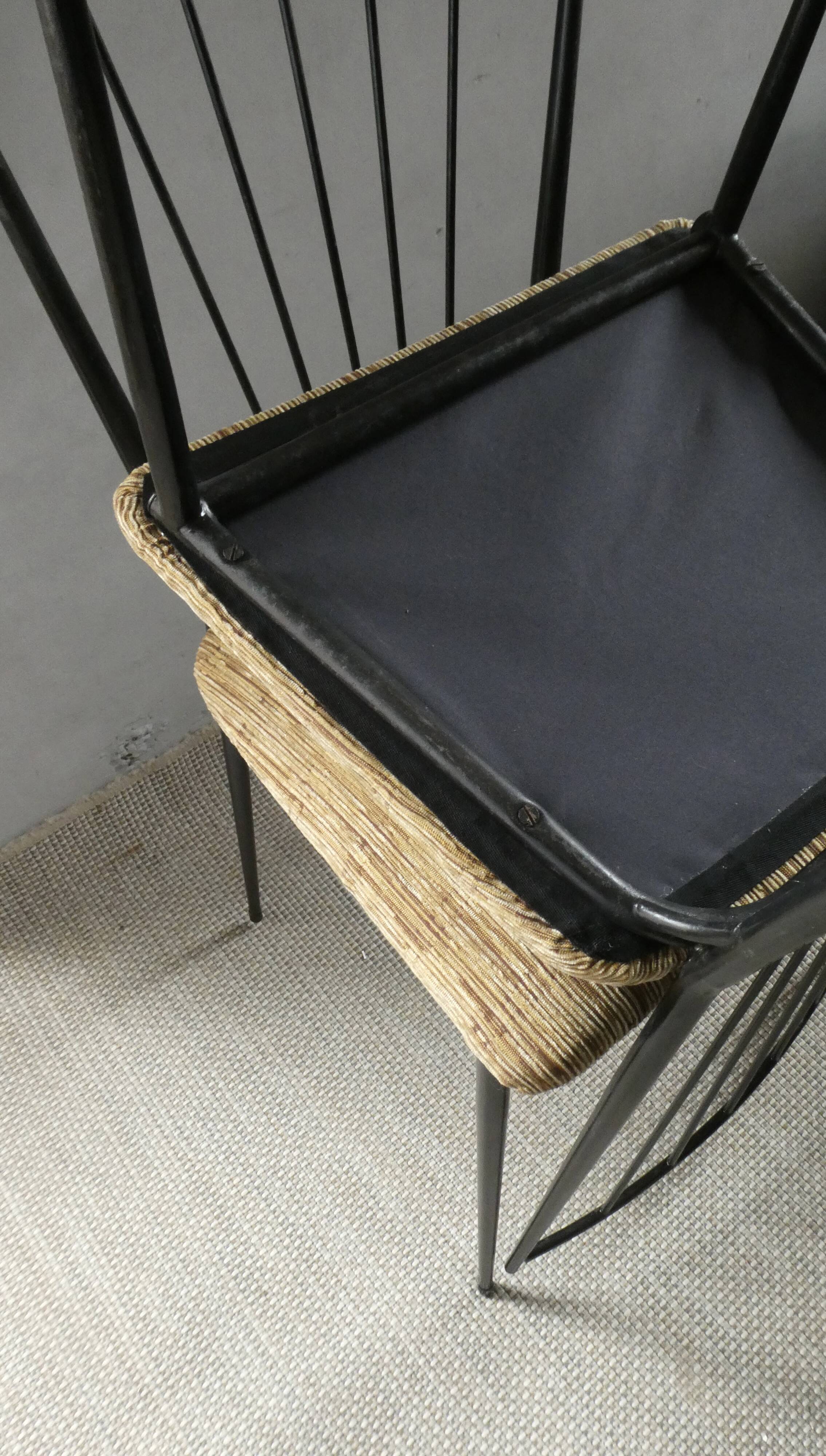 Pair of Colette Gueden chairs, black metal and fabric.