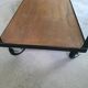 Large central kitchen island trolley on wheels serving industrial console